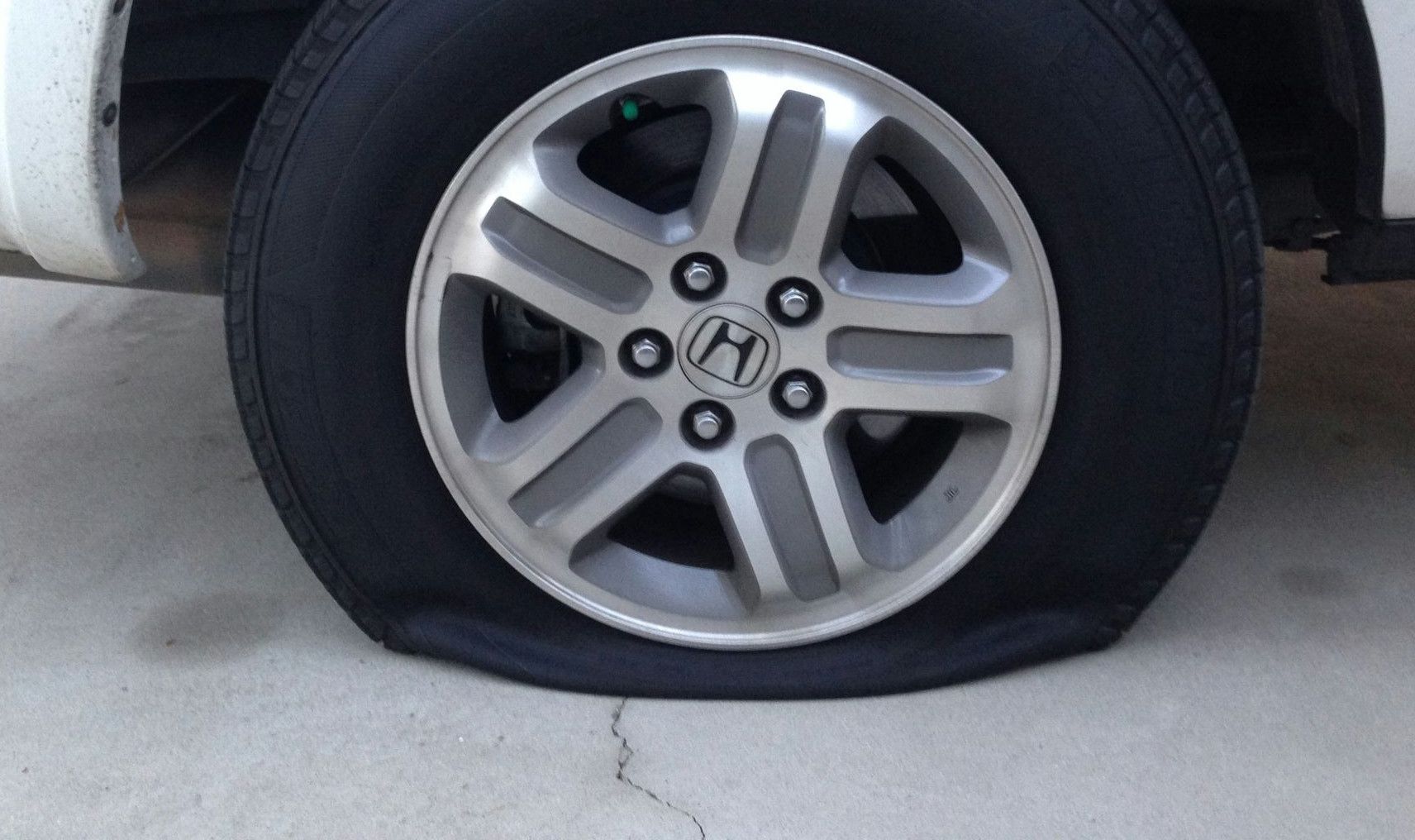 gray 5 spoke wheel with tire